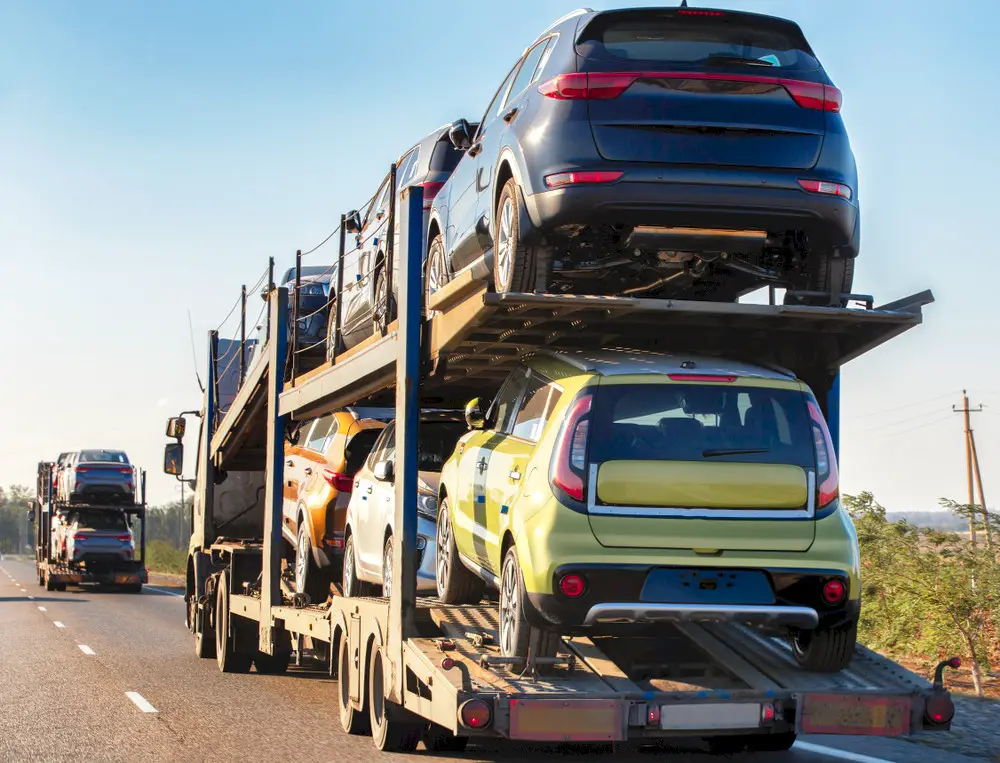 A truck transports a car to another state